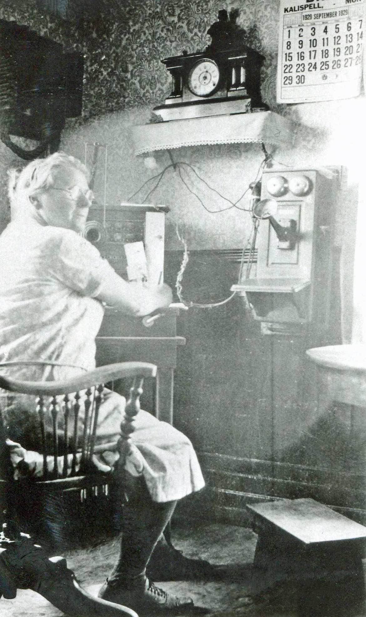 A photo of a woman using a vintage telephone is part of the Northwest Montana History Museum's new exhibit "Tales of Ten Objects: Objects of Progress from the 1910s."