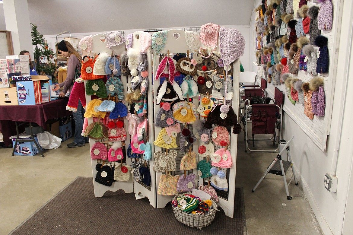 A booth of hats and other crotched items, one of the many booths of fiber art at the Celebration of Craft.