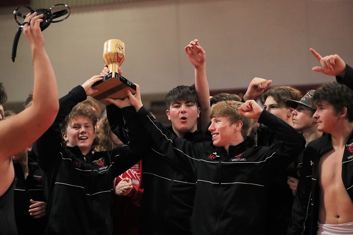 From left: Blake Sherrill, Greg Belgarde and Shane Sherrill raise the "B" Cup following Wednesday's victory.