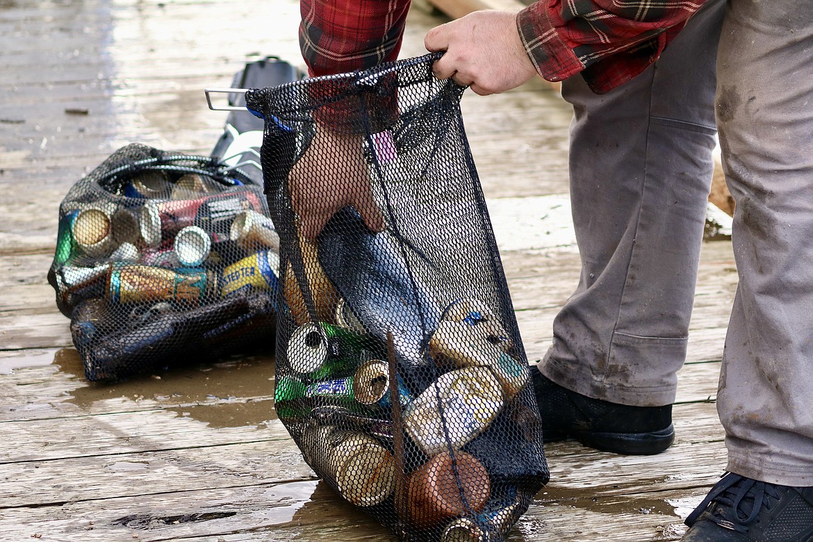 2,640 pounds of trash including around 100 tires, sheet metal, signs, alcohol containers and more was extracted from Lake Coeur d'Alene on Wednesday during the underwater cleanup near Tubbs Hill and the Third Street boat launch. HANNAH NEFF/Press