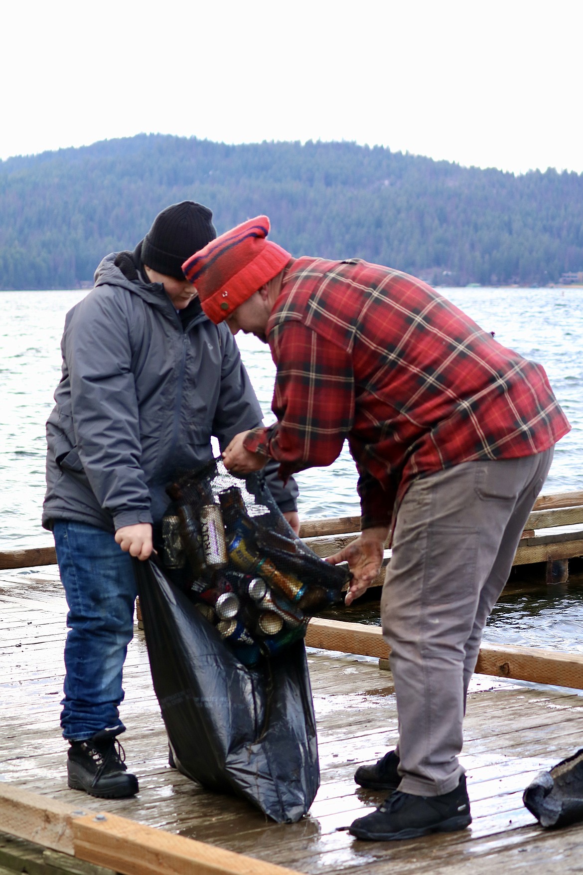 From left, 12-year-old Boyd Rada of Coeur d'Alene and Jasper Wilson of Post Falls volunteered their time to help with the underwater cleanup of Lake Coeur d'Alene on Wednesday. HANNAH NEFF/Press