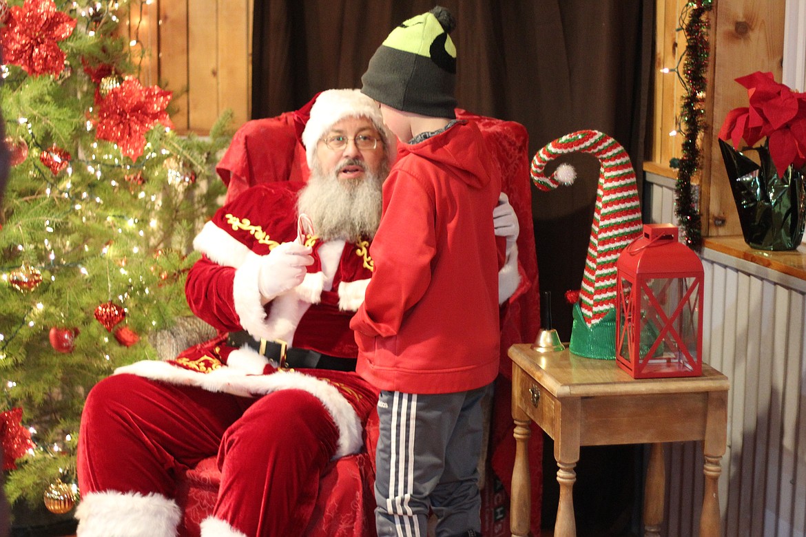 At Santa's Village, Santa talks with a child about what he wants for Christmas.