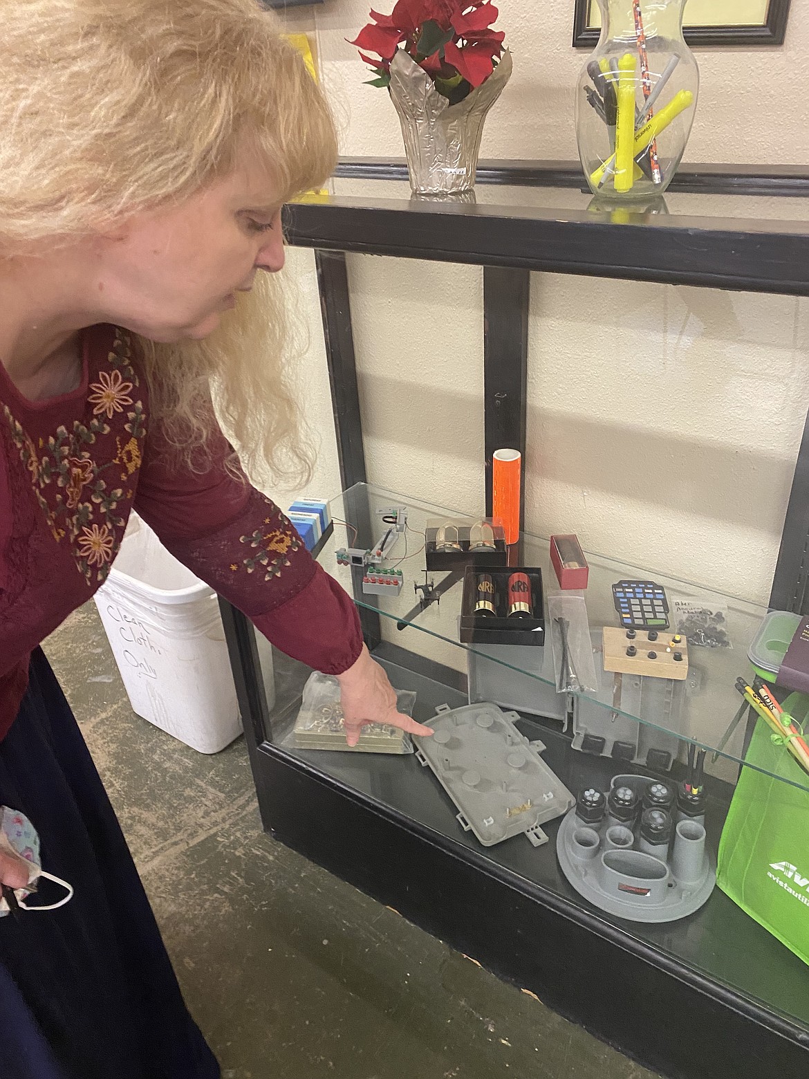 Vice President Terri Johnson points to the intricate projects made in Tesh's Vocational Center. Working with business partners, Tesh clients earn a modest paycheck while learning life skills and serving the community.
