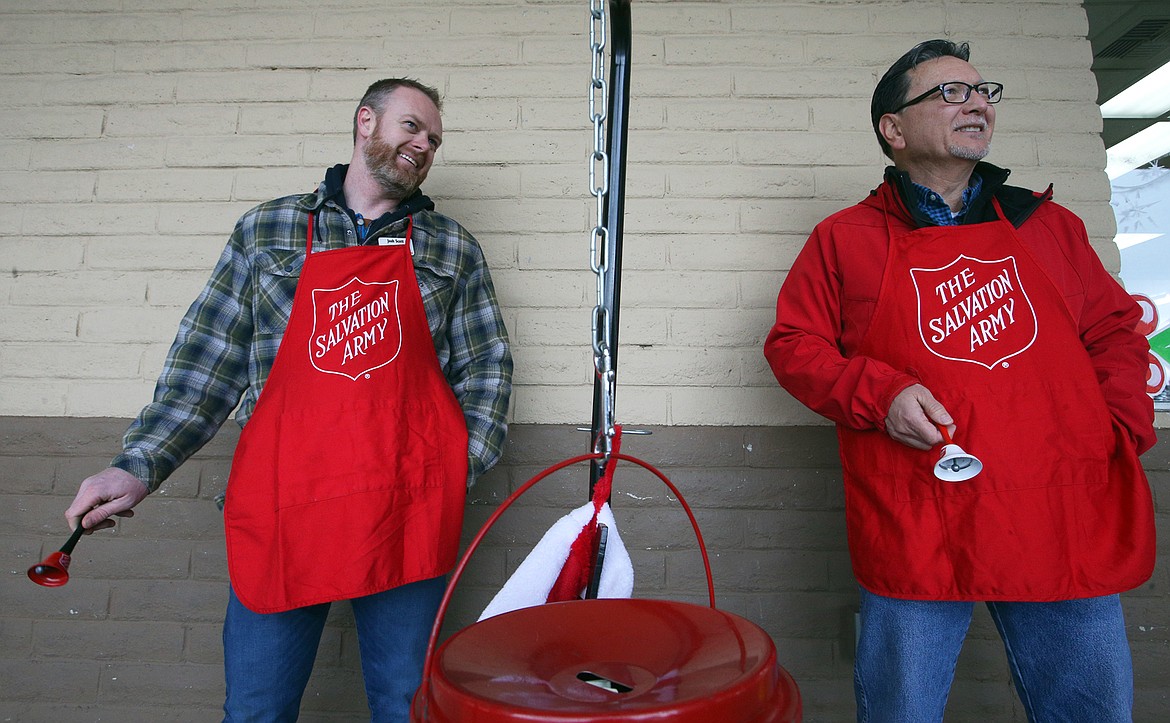 Josh Scott, left, and John Nishimoto ring bells for the Salvation Army Red Kettle campaign on Wednesday outside Super 1 Foods in Hayden.