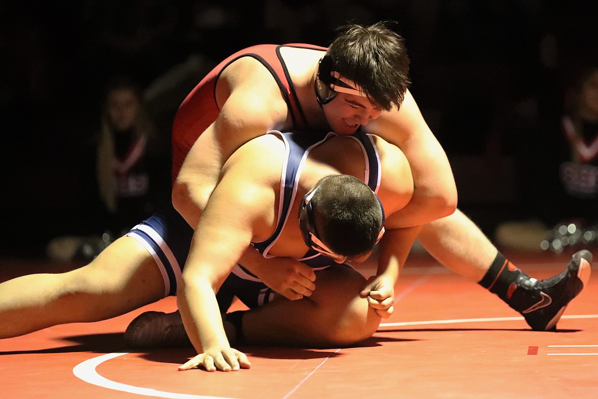 Greg Belgarde (top) wrestles Donald Riess on Wednesday.