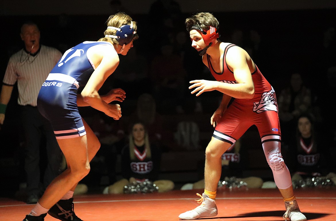 Adam Belgarde (right) faces off with Bonners Ferry's Dakoda Heller during a 152-pound bout Wednesday.