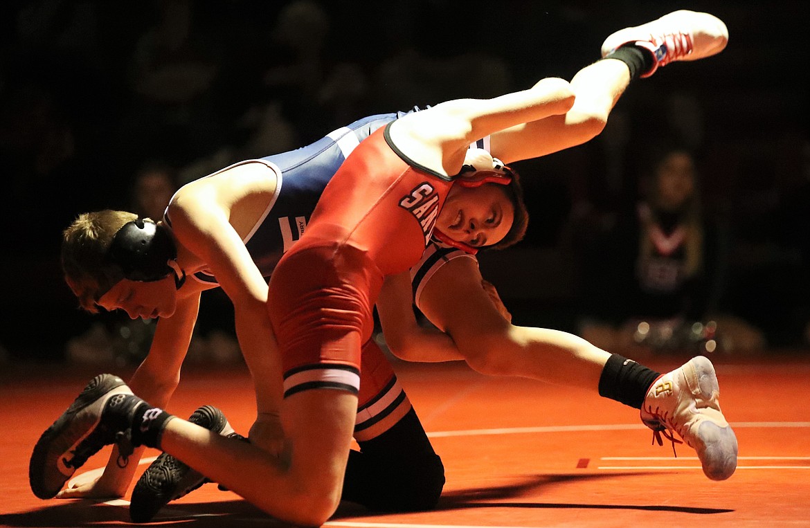 Andrew Duke (bottom) tries to escape the grasp of Bonners Ferry's Brandon Williams during a 98-pound bout Wednesday.