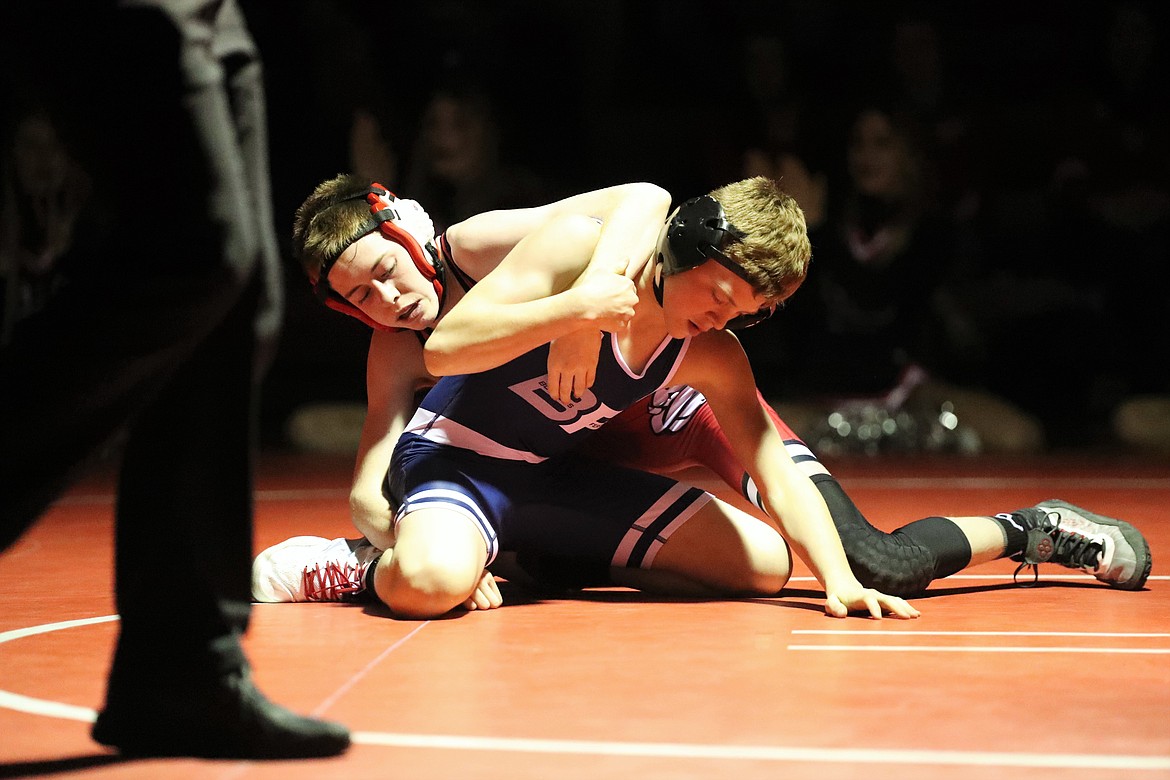 Andrew Duke (top) takes control during his match with Bonners Ferry's Brandon Williams on Wednesday.