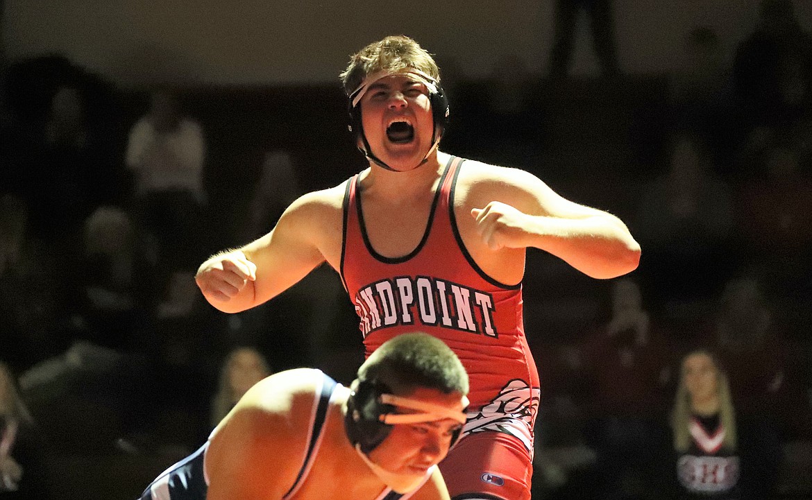 Greg Belgarde celebrates following his victory at heavyweight.