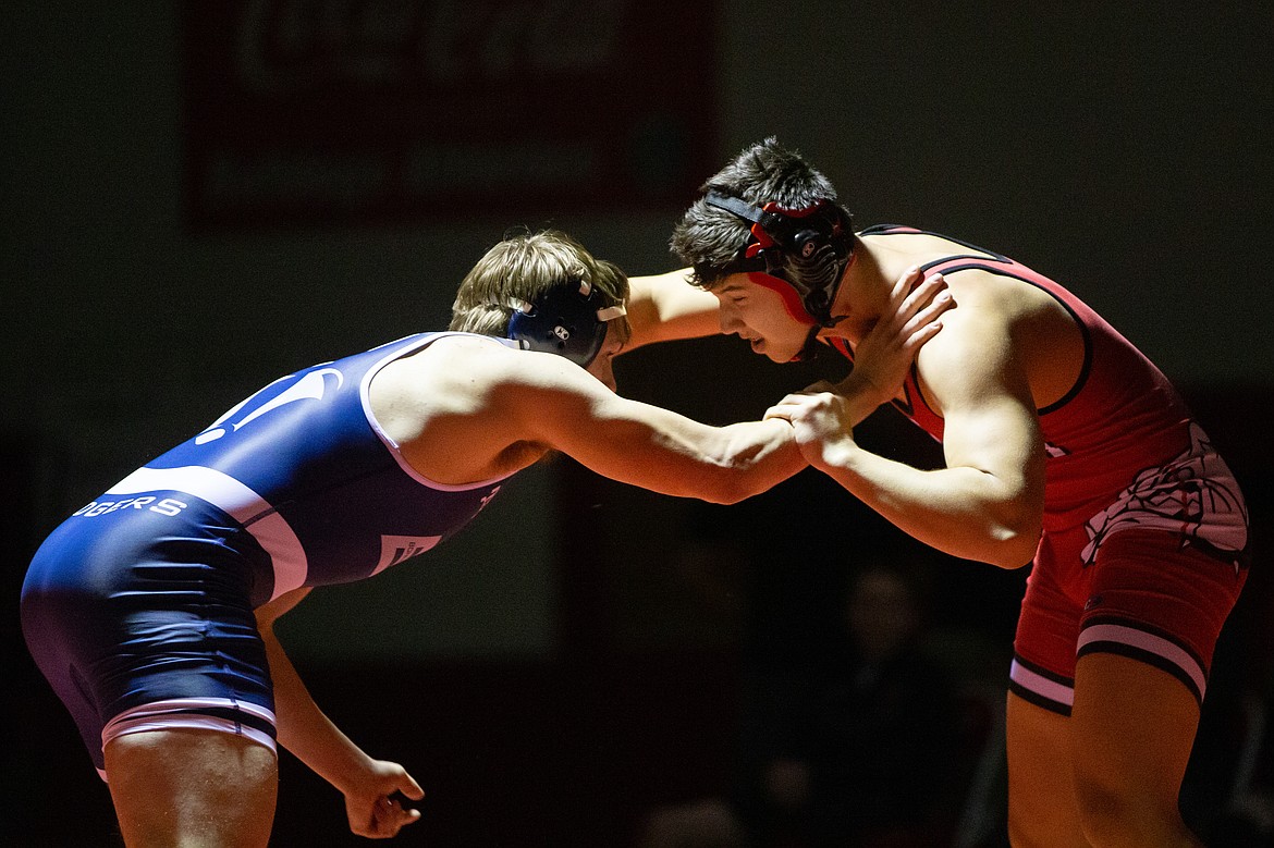 Kai McKinnon (right) battles Bonners Ferry's Cleo Hensley in a 170-pound match Wednesday. McKinnon won the match by pin.