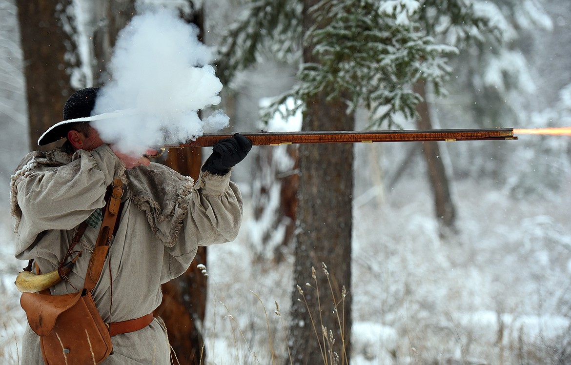 Robert Burns fires a shot at a hanging metal target during a gathering of Flathead Muzzleloaders Association near Columbia Falls Saturday, Dec. 4. (Jeremy Weber/Daily Inter Lake)