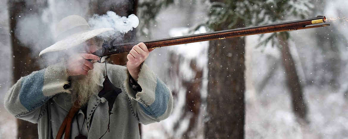 Dave Swanson fires a shot with his flintlock during a gathering of Flathead Muzzleloaders Association near Columbia Falls Saturday, Dec. 4. (Jeremy Weber/Daily Inter Lake)
