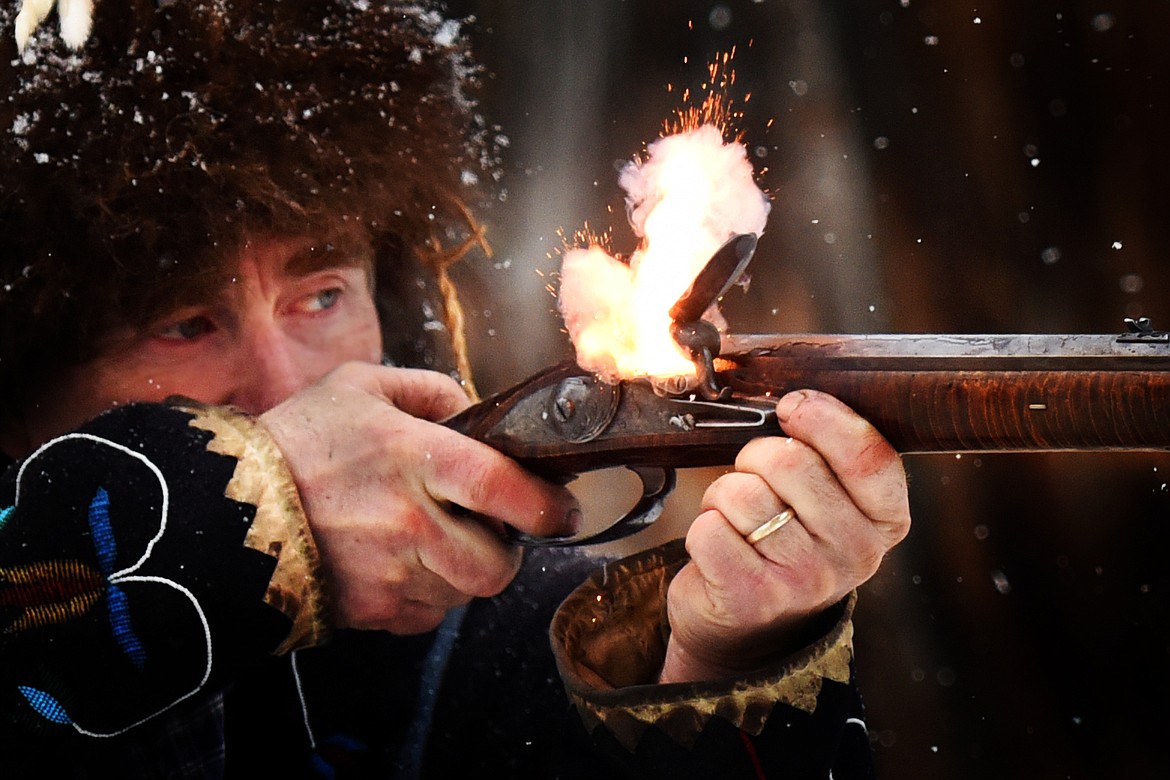 Rod Douglas fires a shot with his pre-revolutionary war flintlock during a gathering of Flathead Muzzleloaders Association near Columbia Falls Saturday, Dec. 4. (Jeremy Weber/Daily Inter Lake)