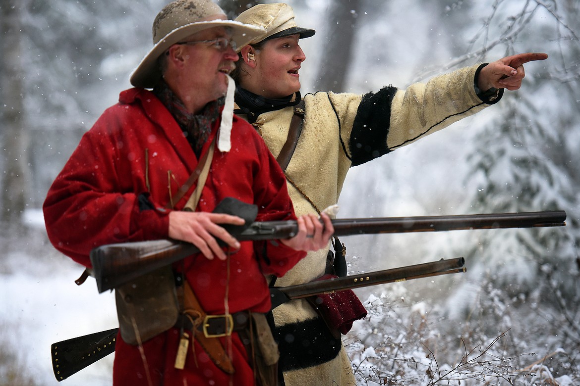 Sean McQueen points out a target to Darryl Askvig during a gathering of the Flathead Muzzleloaders Association Saturday, Dec. 4. (Jeremy Weber/Daily Inter Lake)