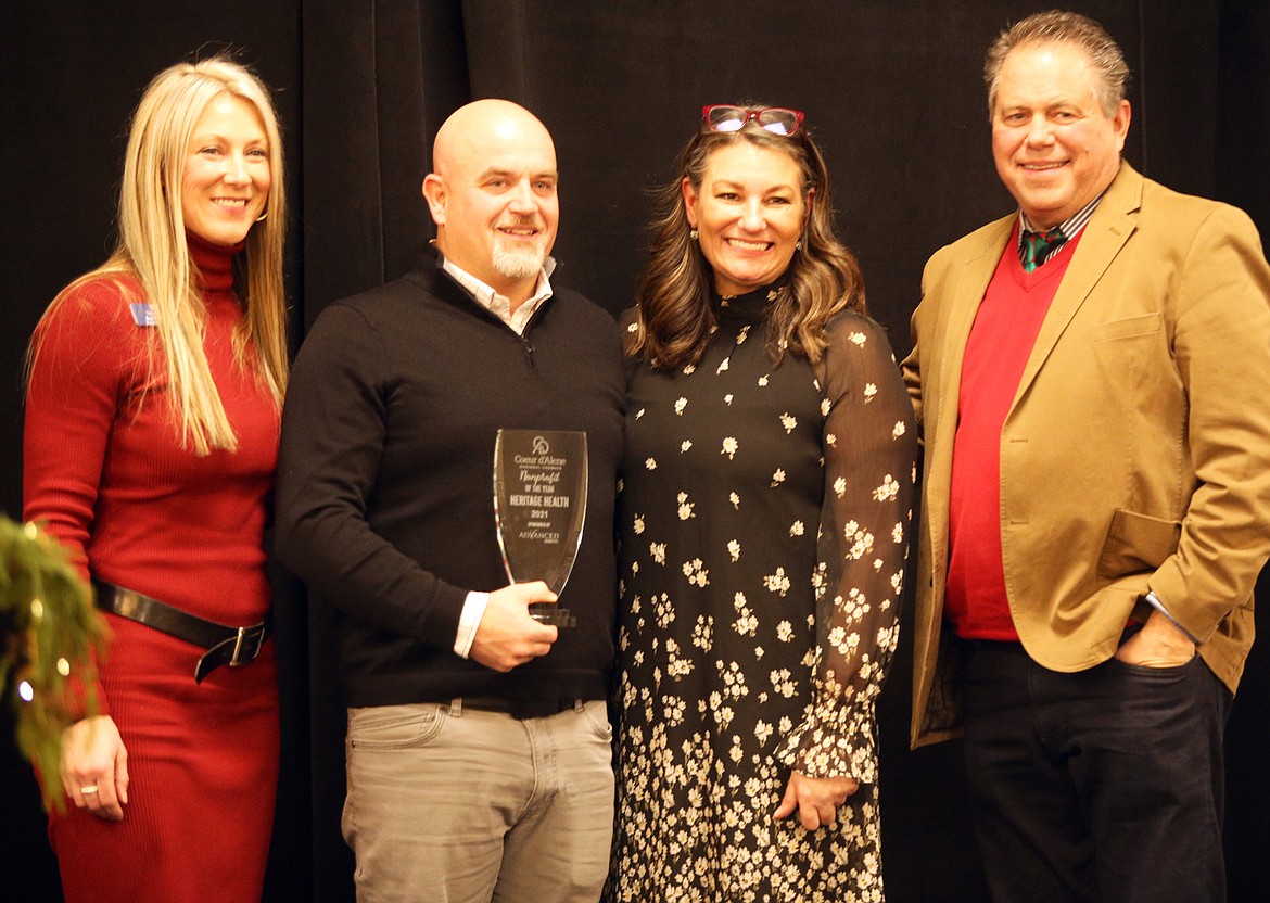 Heritage Health CEO Mike Baker, second from left, holds the award presented to Heritage Health as the Nonprofit of the Year by the Coeur d'Alene Regional Chamber Thursday night at The Coeur d'Alene Resort. He is joined by, from left, Ann Thomas, who received the Ed Abbott Volunteer of the Year, Chamber President/CEO Linda Coppess and Mark Fisher, president/CEO of Advanced Benefits, which received Small Business of the Year.