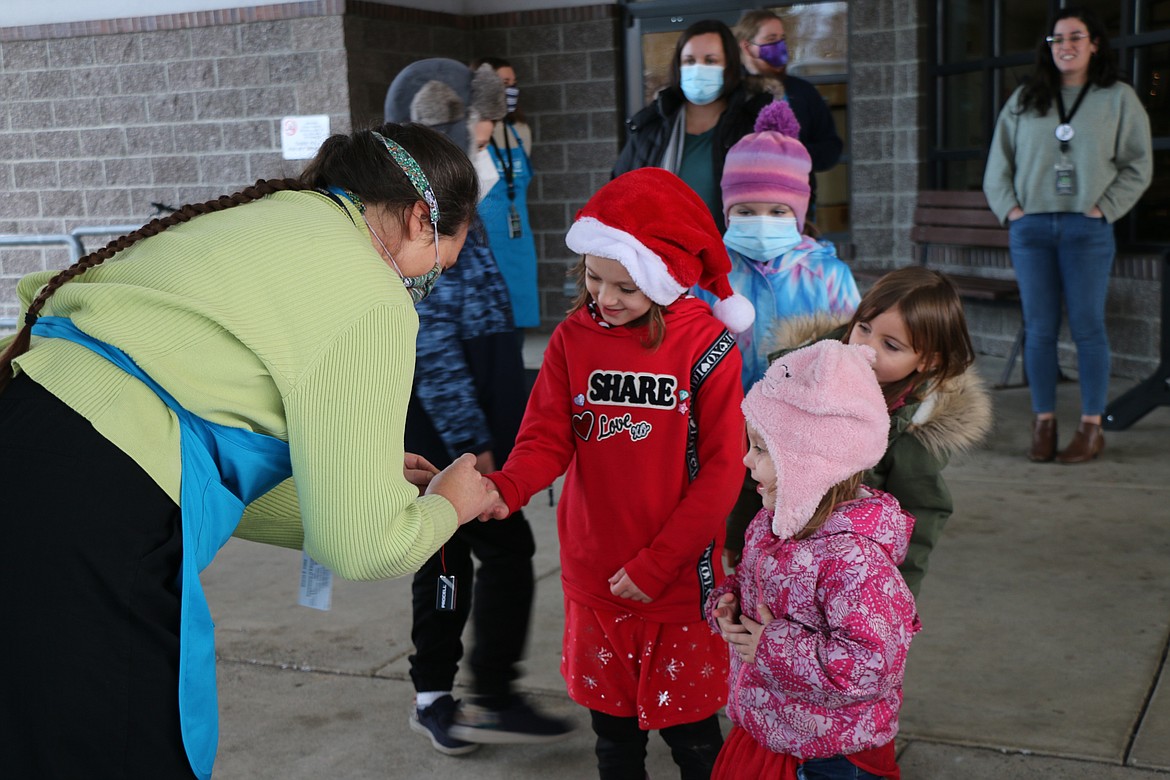 Sharon Cates, STEM coordinator for the Idaho Department of Education, shows students a STEM activity at Monday's unveiling of new Think, Make, Create Labs makserspace trailer.