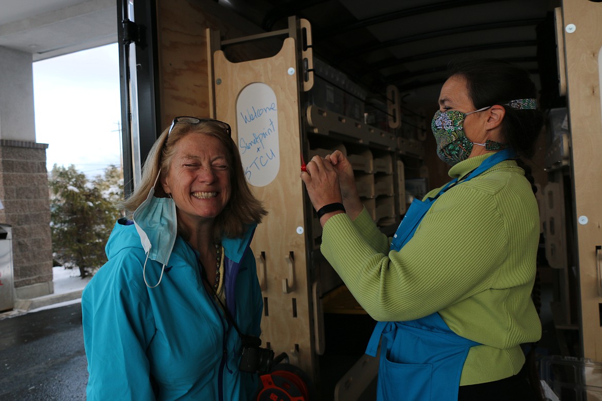 Sharon Cates, STEM coordinator for the Idaho Department of Education, creates a breeze of cold air after creating a small fan using materials from the new Think, Make, Create Labs trailer hosted by the East Bonner County Library District and sponsored by STCU.