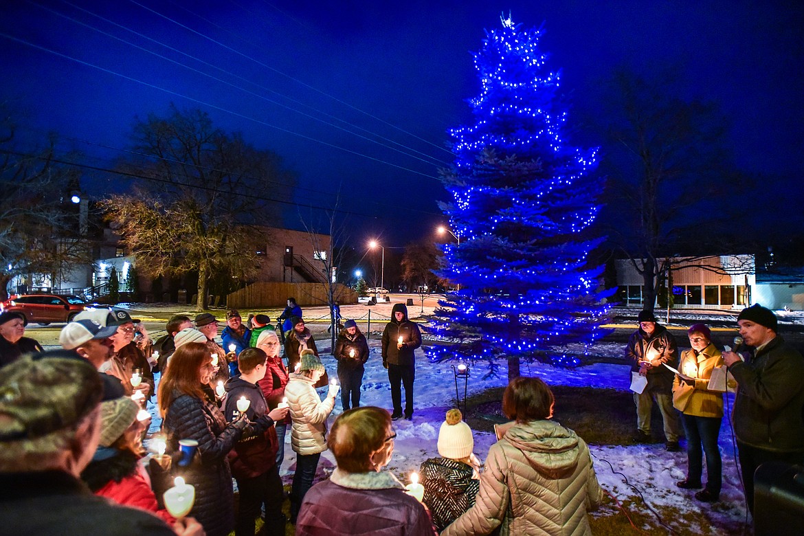 Kalispell Police Chief Doug Overman, bottom right, speaks to the crowd gathered during the annual Blue Light Tree Lighting Ceremony to honor fallen law enforcement officers outside the Flathead County Justice Center in Kalispell on Thursday, Dec. 9. (Casey Kreider/Daily Inter Lake)