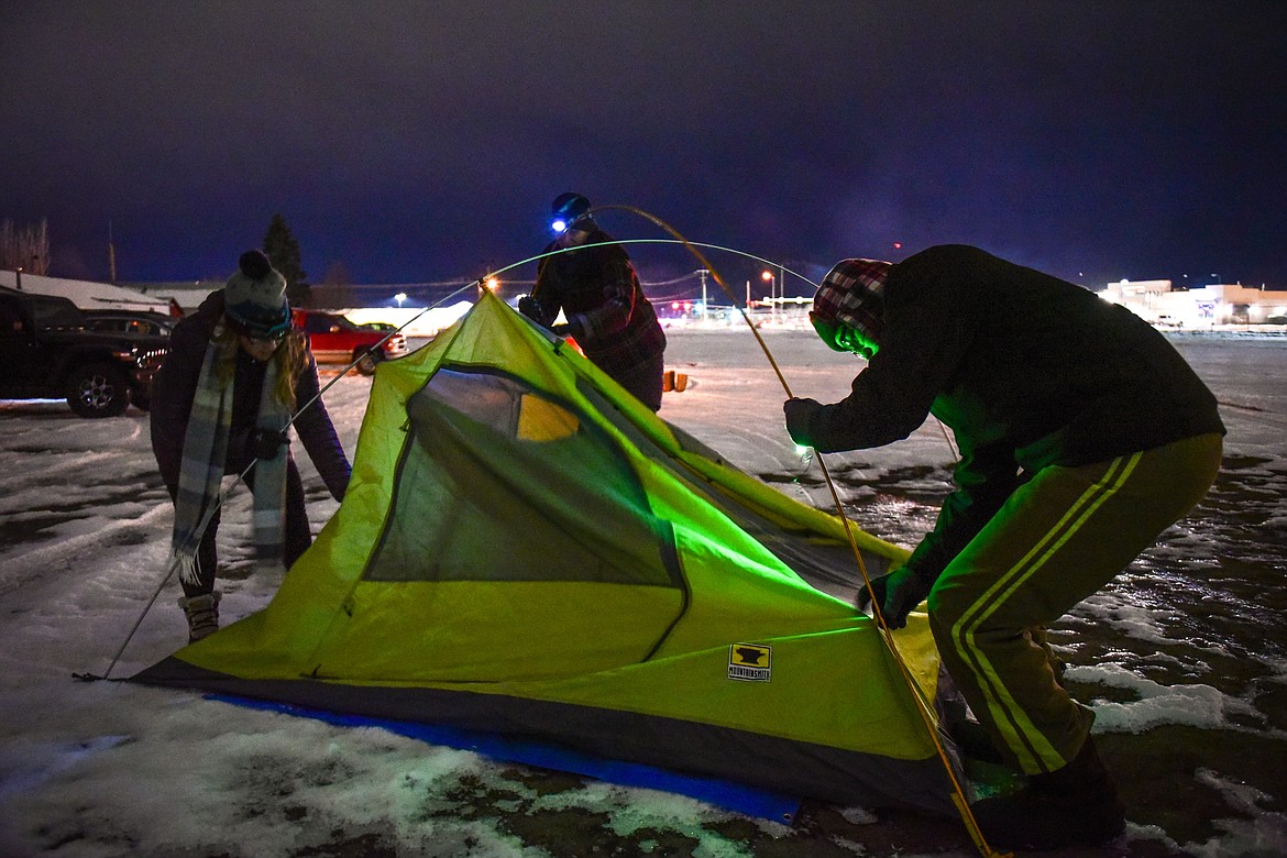 From left, Crystal Thurman, Gretchen Wick and Wynn Olson set up their tent at When the Night Comes, a fundraiser held by the nonprofit Sparrow's Nest of Northwest Montana which benefits homeless high school students in the Flathead Valley on Friday, Dec. 10. Participants spent the night outdoors sleeping in cars and tents at the Flathead County Fairgrounds. Sparrow's Nest received over $42,000 in donations according to executive director Rachelle Morehead. (Casey Kreider/Daily Inter Lake)