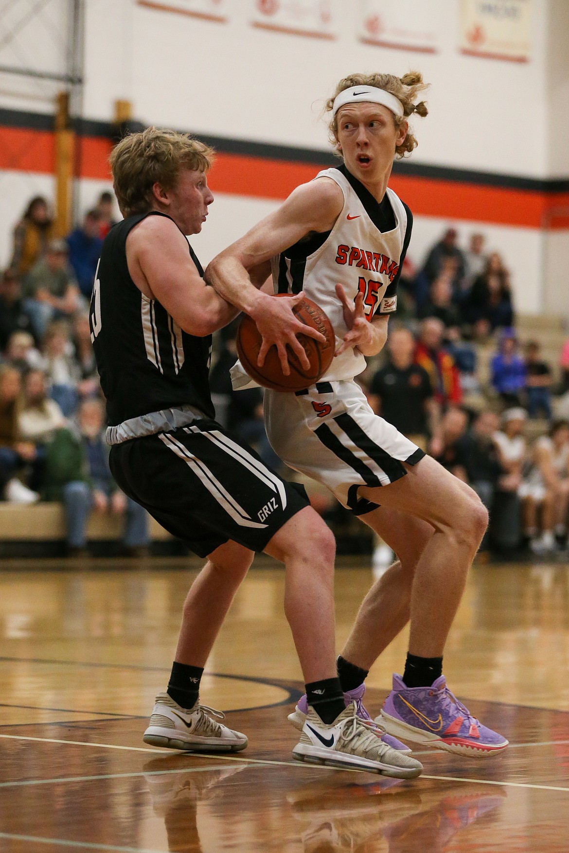 Blake Barrett (right) looks to make a move and attack the basket during Saturday's game.