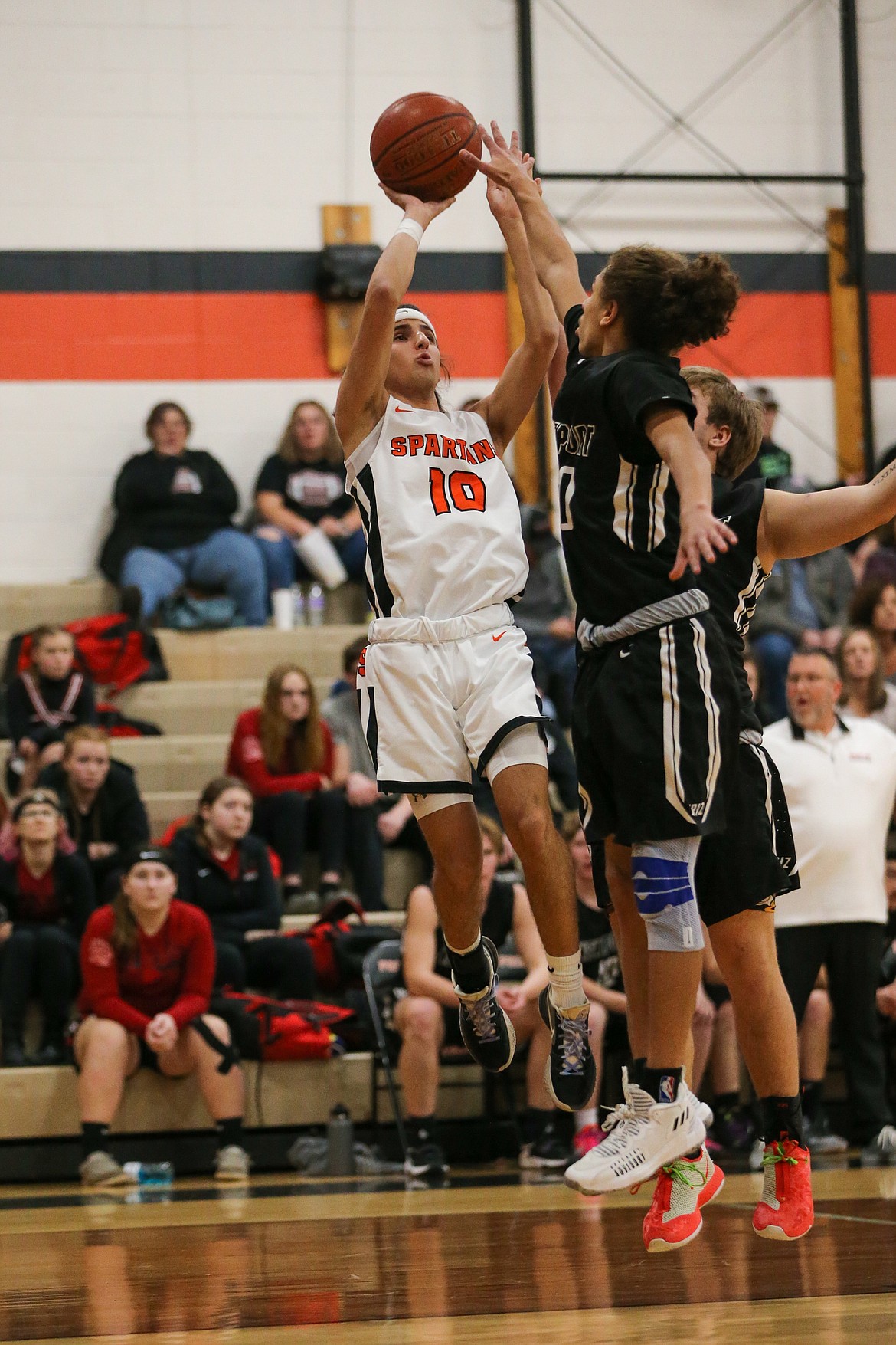 Teigan Marinello rises up to attempt a shot over a handful of Newport defenders Saturday.