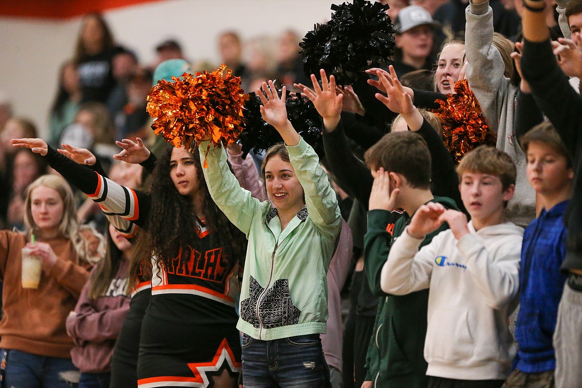 Students cheer on the Spartans on Saturday.