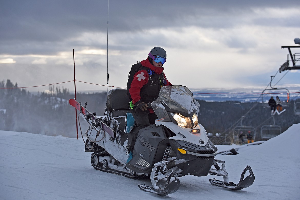 A ski patroller rolls by the base of Chair 1 at Whitefish Mountain Resort's opening day of the 2021-22 season Thursday, Dec. 9. (Whitney England/Whitefish Pilot)