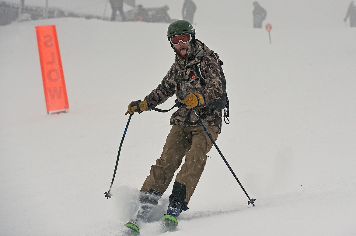 A skier is thrilled to be back on snow during Whitefish Mountain Resort's opening day of the 2021-22 season Thursday, Dec. 9. (Whitney England/Whitefish Pilot)