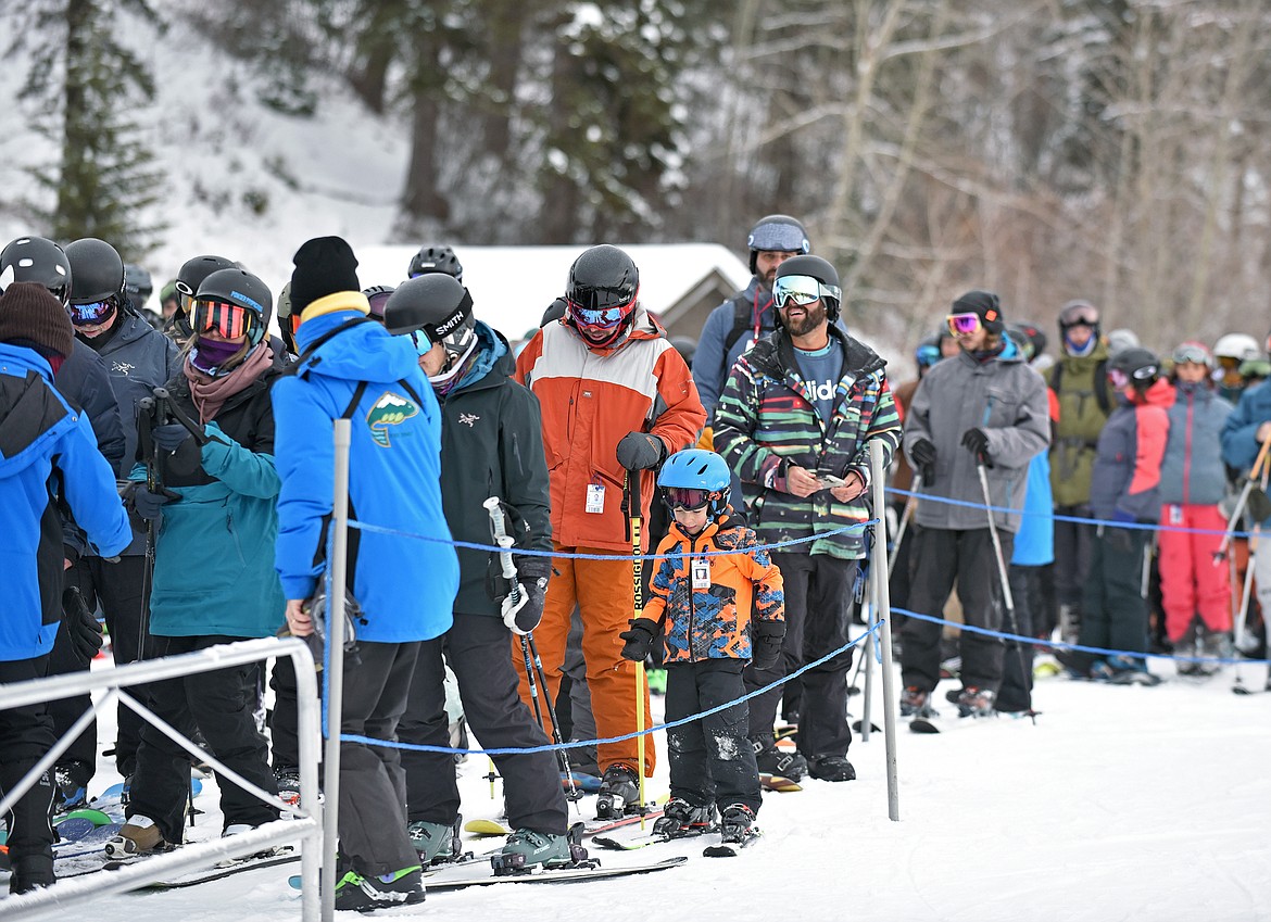 Skiers and snowboarders in line for Chair 1 at Whitefish Mountain Resort's opening day of the 2021-22 season Thursday, Dec. 9. (Whitney England/Whitefish Pilot)