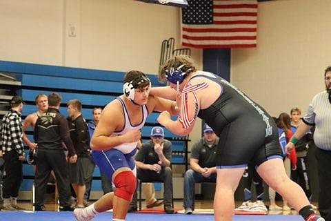 Superior Heavyweight Chan don Gilles (white) battles Sudan Williamson of Libby in the finals of the Bob Kinney Classic Saturday in Superior. Williamson won the match and title. (Kami Milender photo)