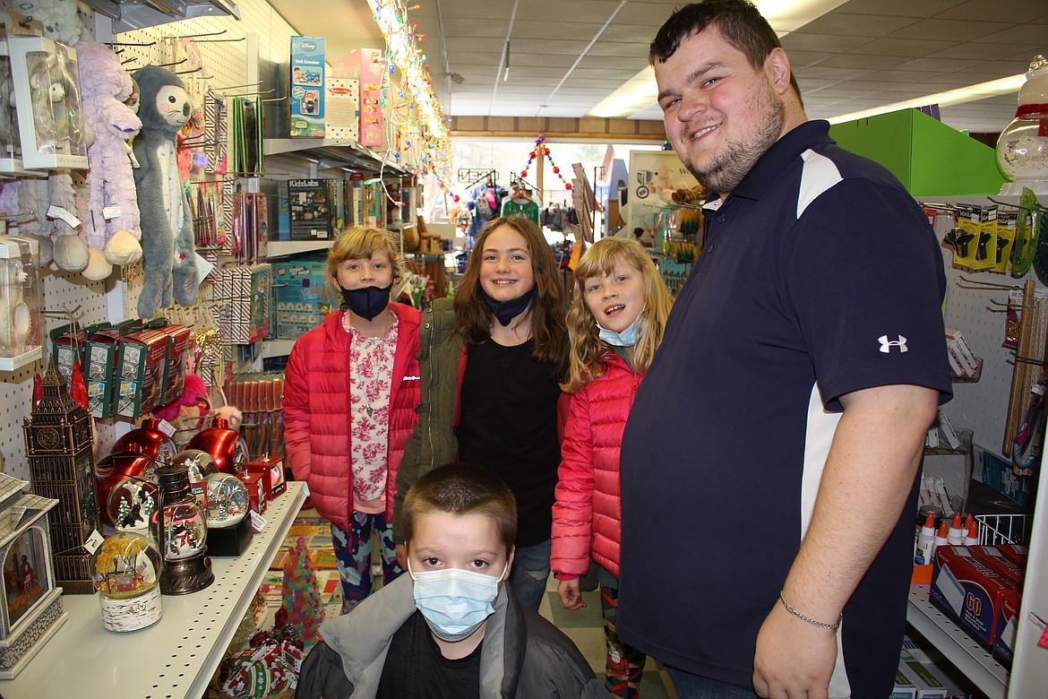 Mrs. Crabb’s fourth-grade students Olivia McGauthy-White, Lillie Radell, Penelope McGauthy-White and Matthew Hendricks were helped by Mineral Pharmacy employee Nathan LaPierre Christmas shopping for toys for children with the record amount of money their class raised in just a bump over two weeks.