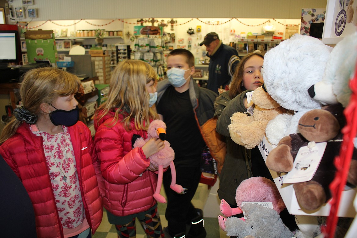 Olivia McGauthy-White, Penelope McGauthy-White, Matthew Hendricks and Lillie Radell, 4th Grade Students of Mrs. Stacy Crabb went Christmas shopping for other children in Mineral County with $75.75 each using the money their class raised for this annual community service event.