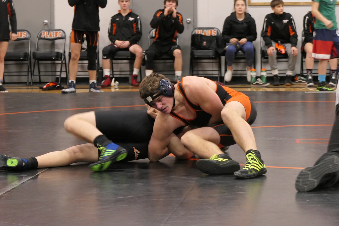 Plains sophomore Spur Ryan get control of his Bigfork opponent in the 160-pound division during the opening matches of the Plains Quad Thursday at Plains High School. Ryan won by pin. (Chuck Bandel/Valley Press)