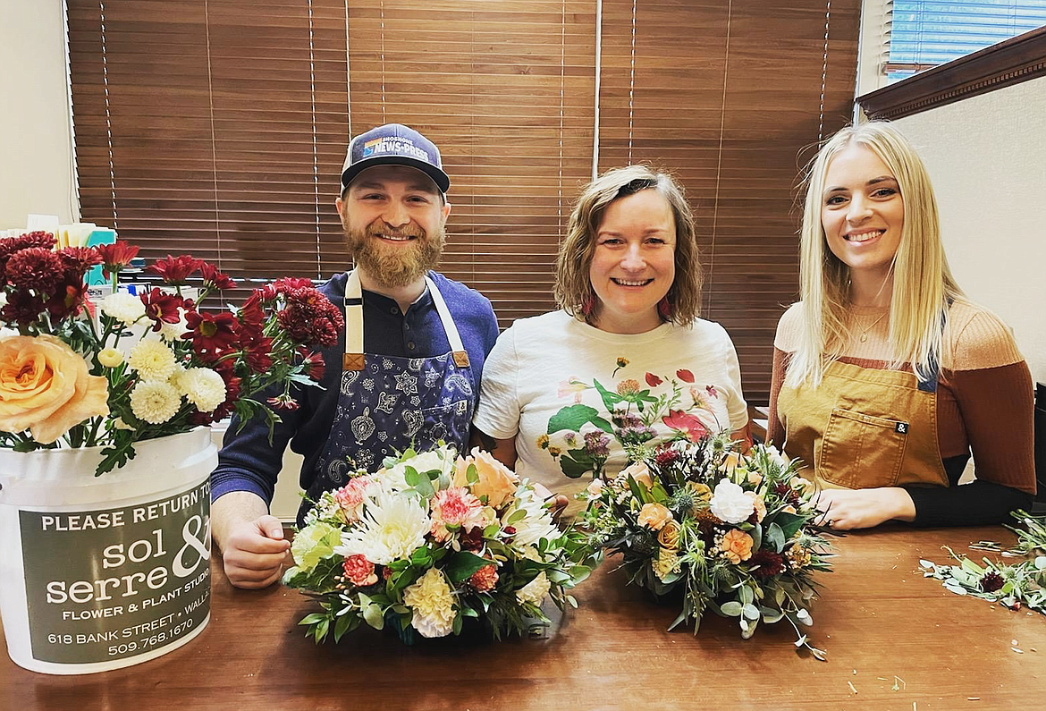 Shoshone News-Press Editor Chanse Watson along with florist Sarah Murphy and staff reporter Chelsea Newby designed holiday centerpieces as one of the fun activities during the Silver Valley Community Christmas Fund fundraising event at the News-Press office last week.