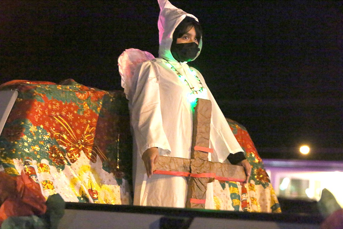 An angel brings the good news on a float in the Christmas in the Park parade in Mattawa Friday.