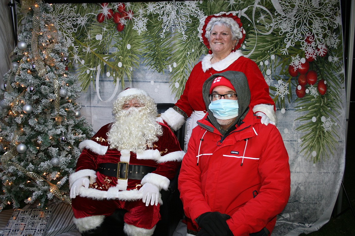 Everybody wanted their picture taken with Santa and Mrs. Santa, close friends of Jack Fox and Dana Fox, including Mattawa City Council member Brian Berghout, right.