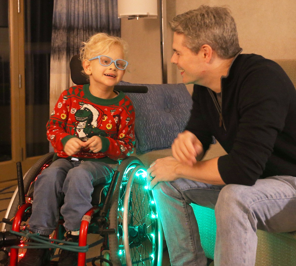 Casey Parks chats with his son Ford Parks in their room at The Coeur d'Alene Resort on Saturday.