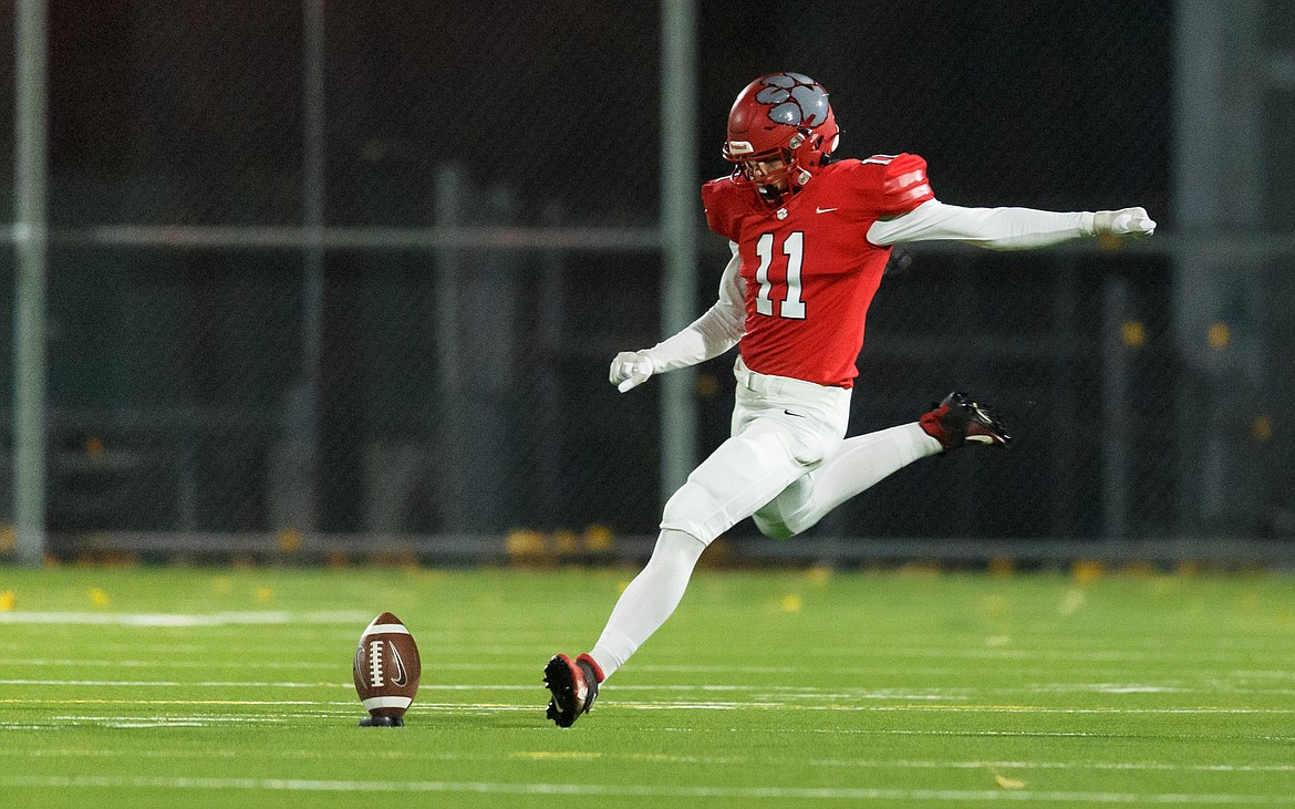 Senior Lasse Kuhn, a foreign exchange student from Germany, blasts a kickoff during the 4A state playoff game against Mountain Home on Oct. 29 at War Memorial Field.