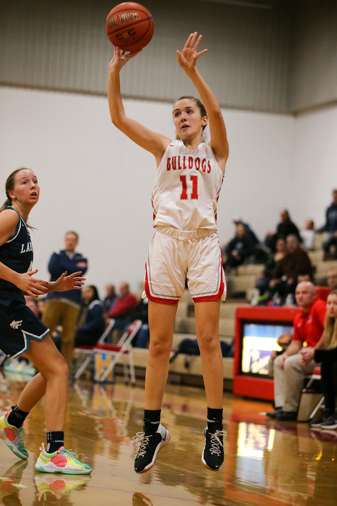 Tru Tomco hits a 3-pointer during Tuesday's game.