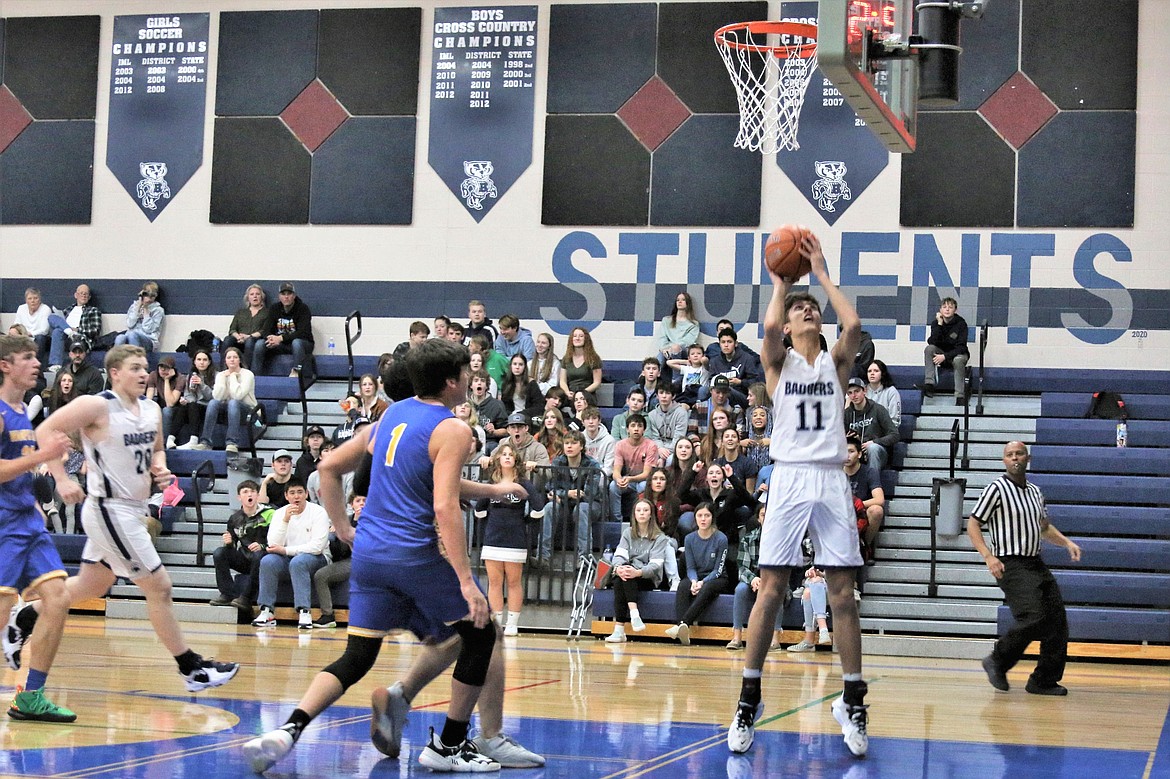 Riley Petesch making a basket against Clark Fork earlier in the season. Against Lincoln County at the Battle for the Border Petsech had four points and three rebounds. He had two points and one rebound against St. Maries.