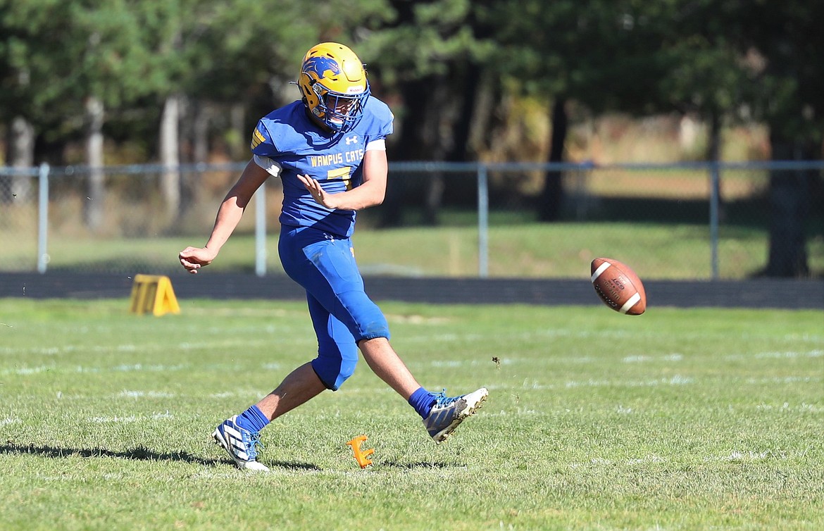 Senior Carter Sanroman attempts an onside kick during a game against Kootenai this fall.