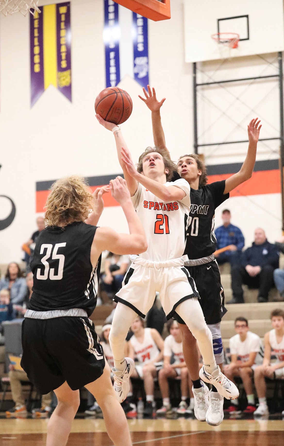 Coner Berns attacks the basket and converts a layup Saturday.