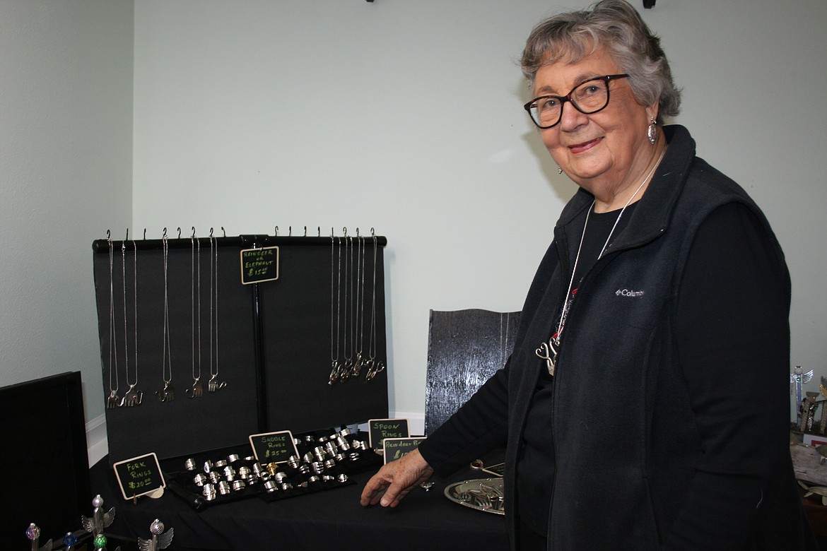 Mary Courtright shows off some of her turtle figurines.