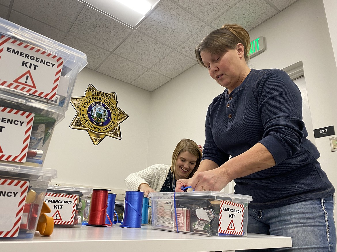 Kootenai County Office of Emergency Management Director Tiffany Westbrook, left, and former KCSO Capt. Kim Edmondson volunteered at the inaugural "Preparedness for a Cause" drive on Wednesday. (MADISON HARDY/Press)