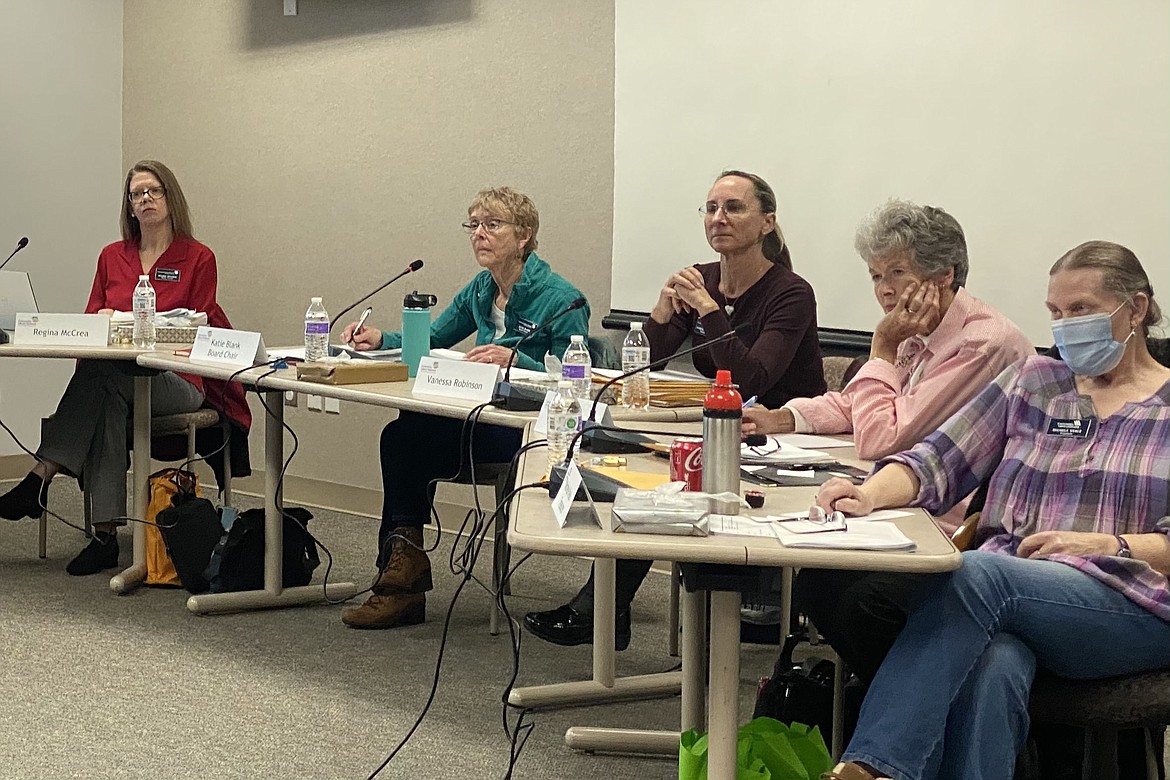 The Community Library Network board of trustees listened to nearly an hour of public comment regarding the presence of LGBTQ and sexual materials in facilities. From left, Regina McCrea, Katie Blank, Vanessa Robinson, Judy Meyer, Michele Veale. (MADISON HARDY/Press)