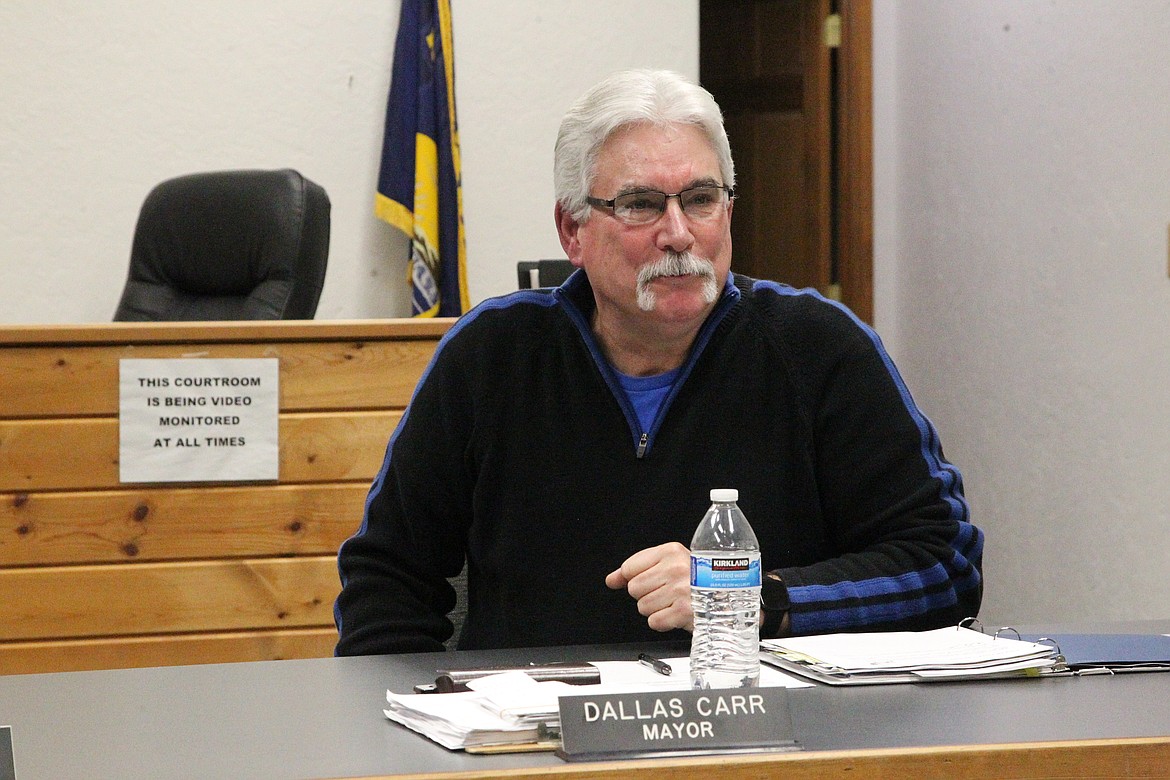 Outgoing Troy Mayor Dallas Carr commends his colleagues during his last council meeting as the city's top official on Dec. 15. (Will Langhorne/The Western News)