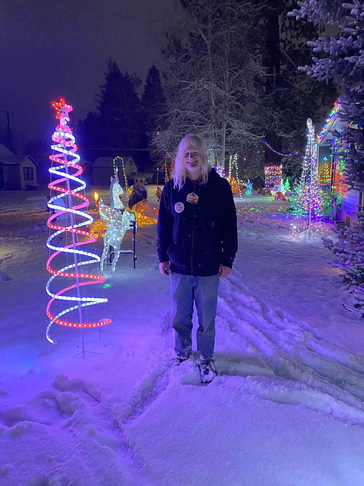 The warm glow of Casey Brown's magical Christmas light display attracts neighborhood visitors daily, Brown said.