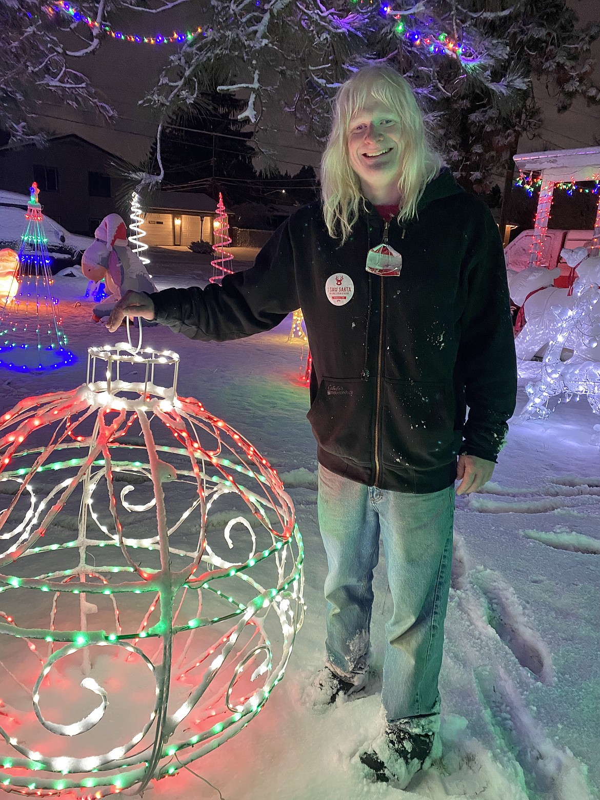 Light master Casey Brown stands amidst the glorious light display he creates in his front yard annually.