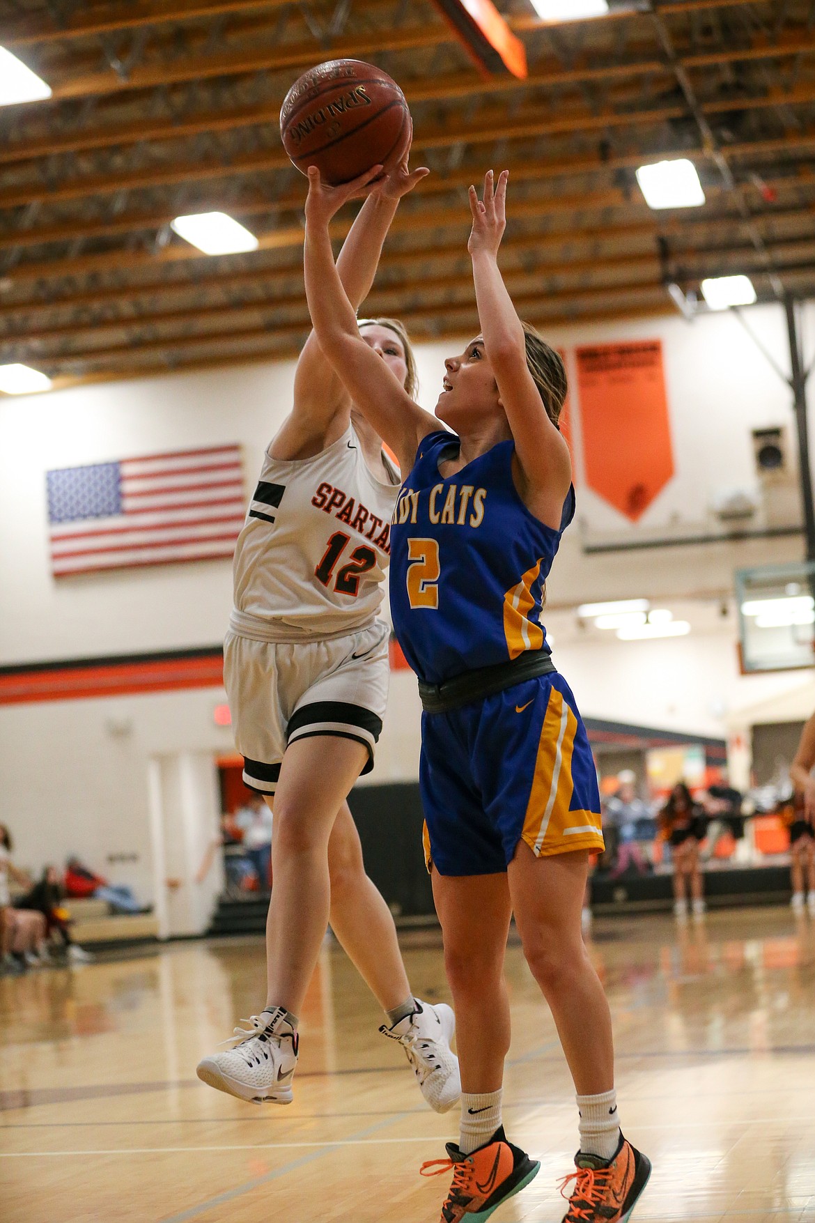 Priest River freshman Desarai Humphrey (left) rises up to block a shot attempt by Clark Fork's Paige Valliere during the Spartan Christmas Tournament on Friday at PRLHS.