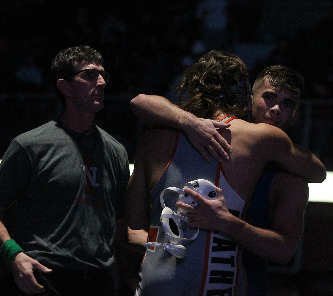 JASON ELLIOTT/Press
Coeur d'Alene's Rylan Rogers gets a hug from Flathead's Chase Youso following the 195-pound championship match at the Tri-State Invitational on Saturday at North Idaho College. Rogers won by pin in 3 minutes, 26 seconds.